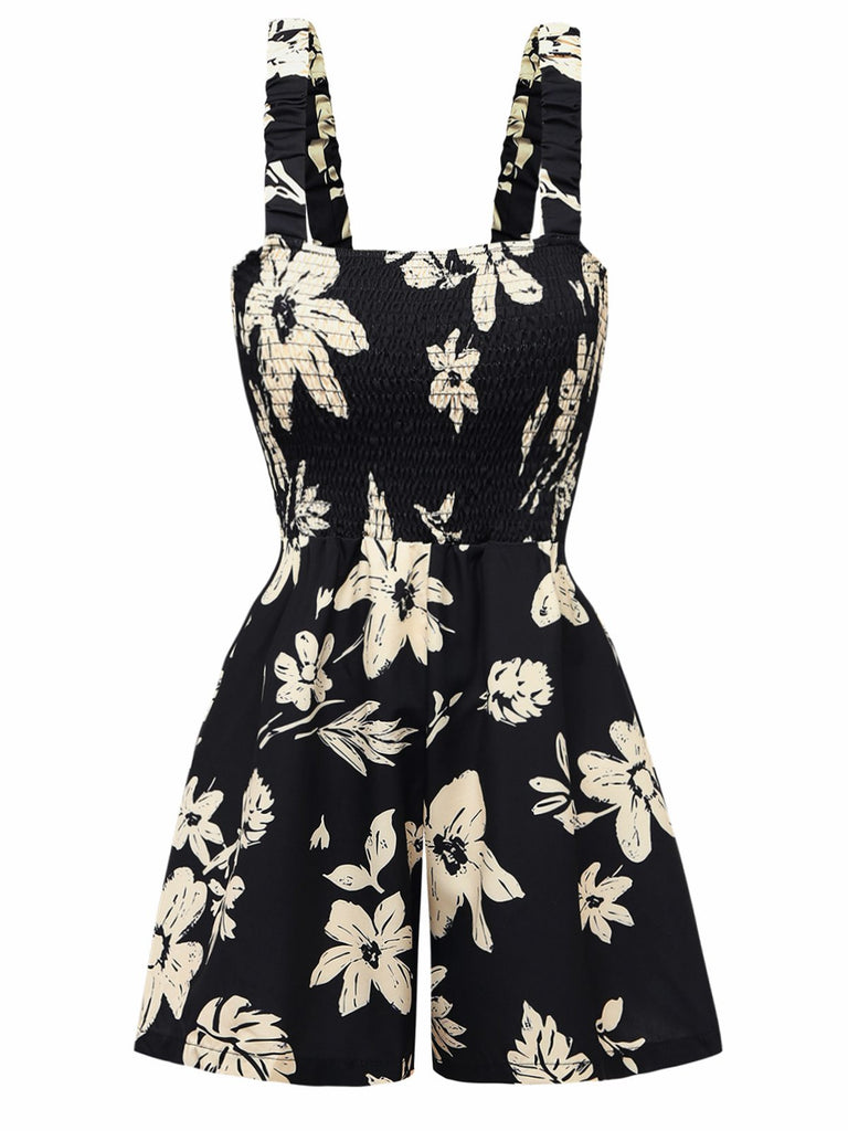 Schwarzer Strampler mit weißem Blumenmuster auf weißem Hintergrund