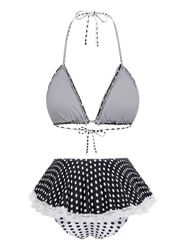 Bikini-Set mit grauem Oberteil und schwarzem gepunktetem Höschen auf weißem Hintergrund