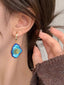 Vintage Ohrringe mit blauem Blumen-Anhänger