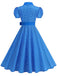 Vintage-Swingkleid mit Polka-Dots, Gürtel und Hemdkragen im klassischen Retro-Stil der 1950er Jahre.