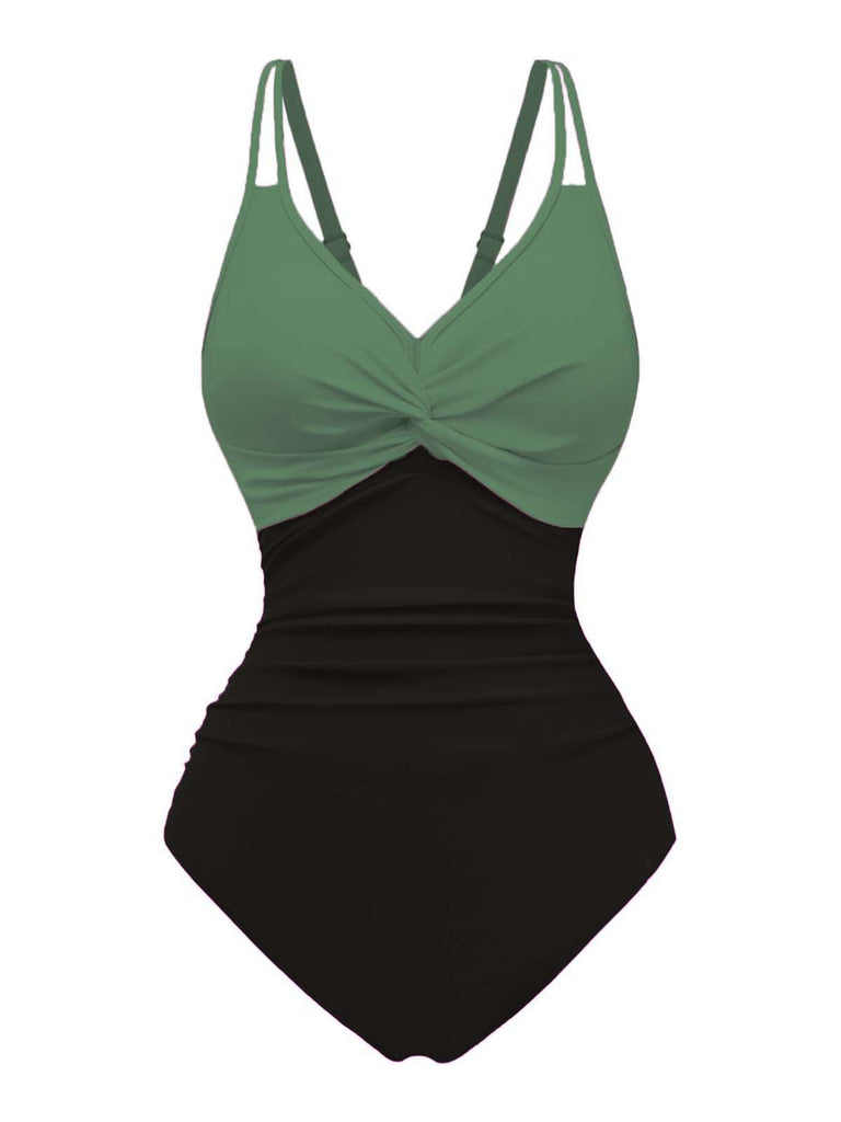 Grüner und schwarzer Badeanzug auf weißem Hintergrund