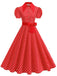 Vintage-Swingkleid mit Polka-Dots, Gürtel und Hemdkragen im klassischen Retro-Stil der 1950er Jahre.