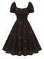 [Vorverkauf] Schwarzes 50er Midikleid mit Himbeer-Print und Neckholder