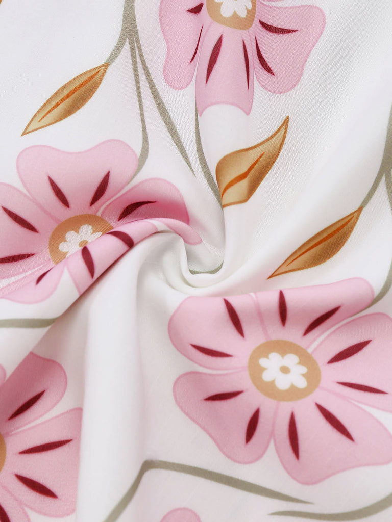 Rosa 60er Kleid mit Spaghettiträger und Blumen