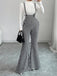 Schwarz-weißer 60er Overall-Jumpsuit mit Hahnentritt und Schlagbein
