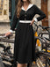 Schwarzes & Weißes 50er Kleid mit Revers und V-Ausschnitt