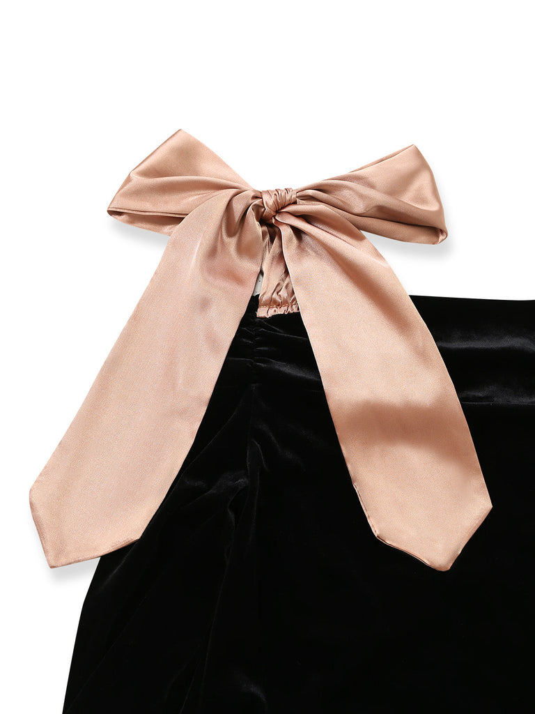 Schwarzes 60er Kleid mit Schulterschleife und betonter Taille