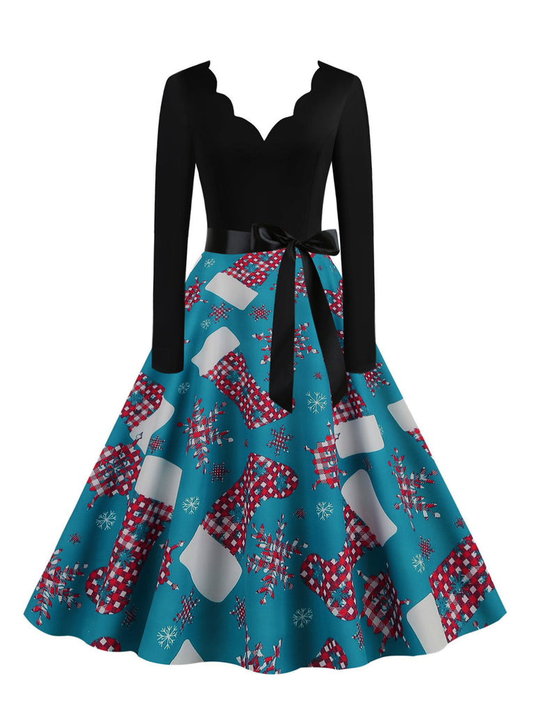 Blaues 50er Weihnachts-Swingkleid mit Strumpf-Print und Wellenausschnitt