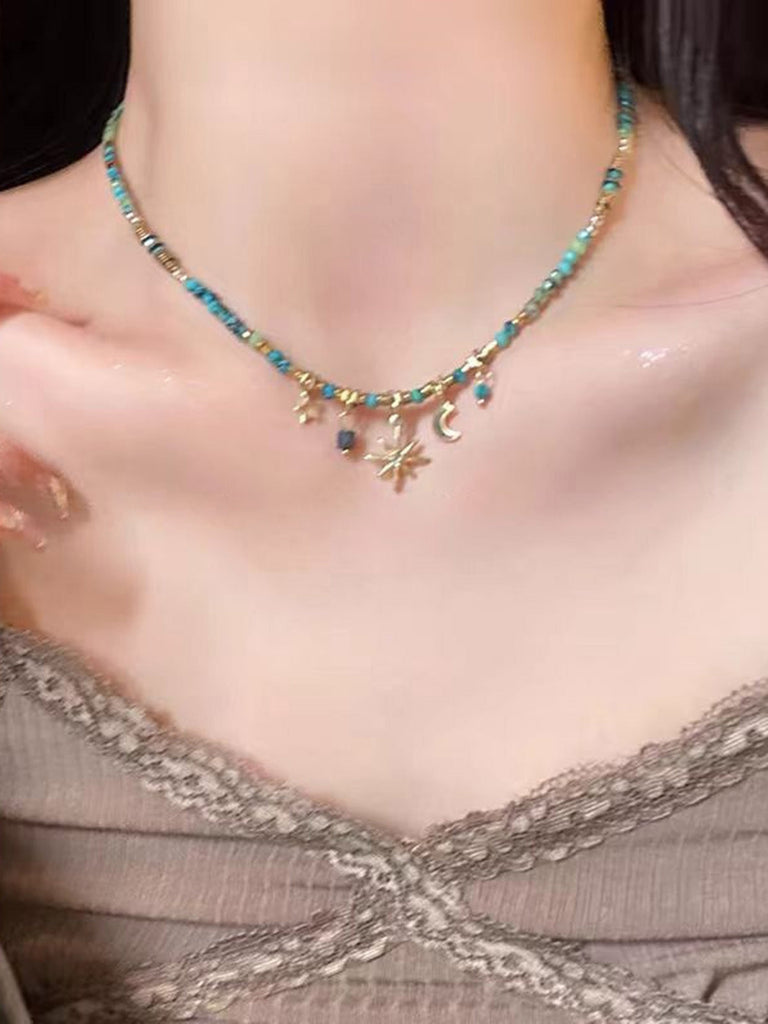 Boho-Halskette mit Perlen, Stern, Mond und Sonne-Anhänger in Türkis