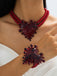 Rotes Armband mit Herz und Perlen