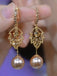 Goldene Ohrringe mit Blatt und Strass