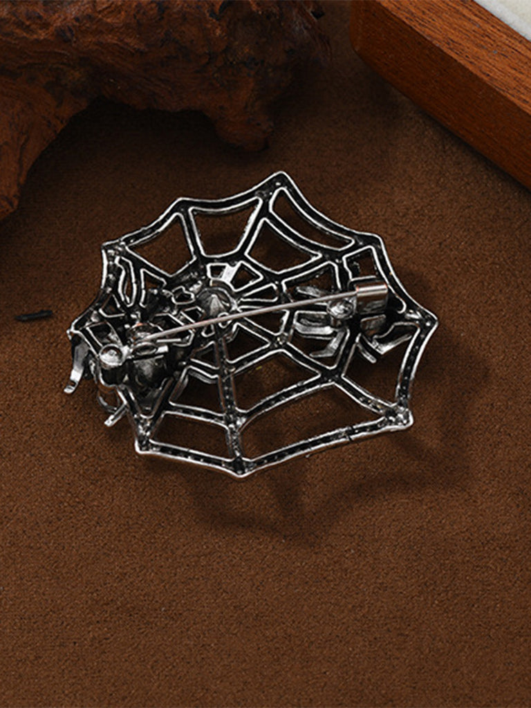 Brosche mit Strass und Spinnennetz