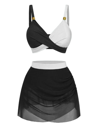 Schwarz-weißes zweiteiliges Outfit bestehend aus BH und Rock vor weißem Hintergrund