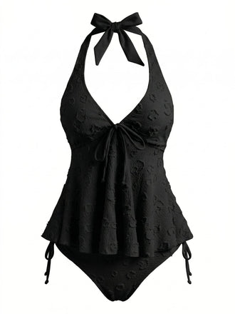 Retro-Tankini im Stil der 50er Jahre mit strukturiertem Blumenmuster, tiefem V-Ausschnitt und Neckholder-Trägern für einen klassischen Strandlook.