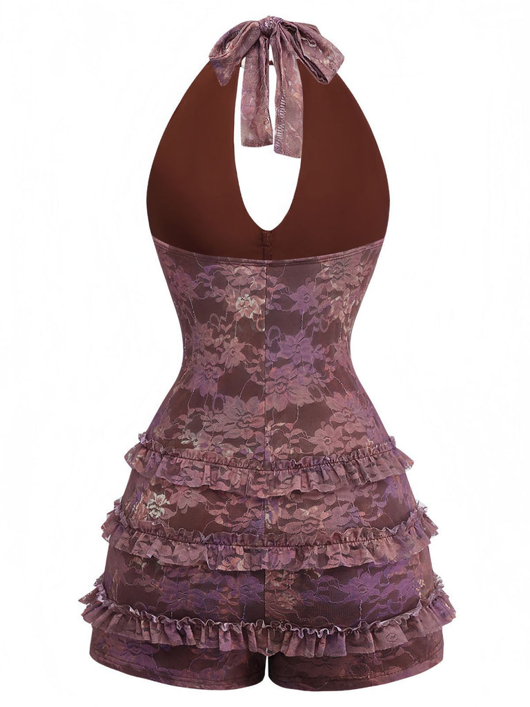 Rückansicht des lila geblümten Spitzen-Rompers, die das elegante rückenfreie Design und den Neckholder-Verschluss zeigt.