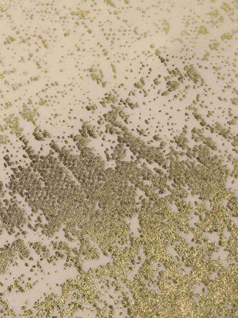 Strukturierter Stoff mit einem Muster in Gold- und Beigetönen