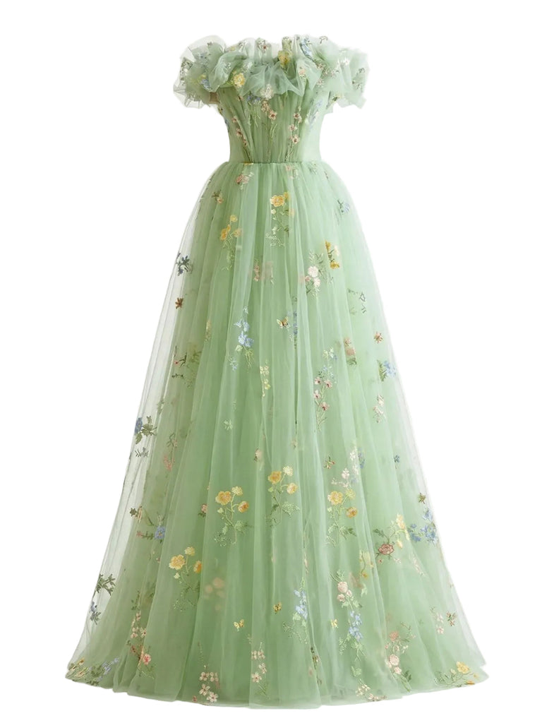 Grünes Blumenkleid auf weißem Hintergrund