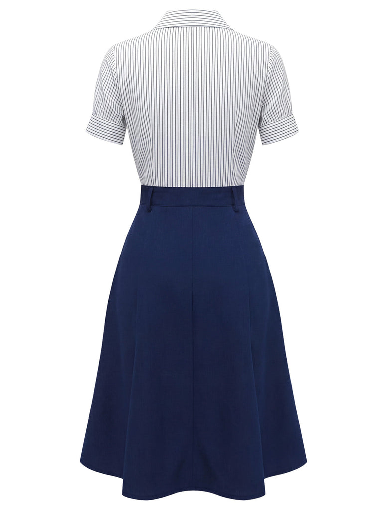 Rückansicht des Outfits aus Nadelstreifenbluse und marineblauem Rock.