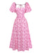 Studioansicht von vorne auf das rosa geblümte Midikleid, das die taillierte Passform und den ausgestellten Rock betont.