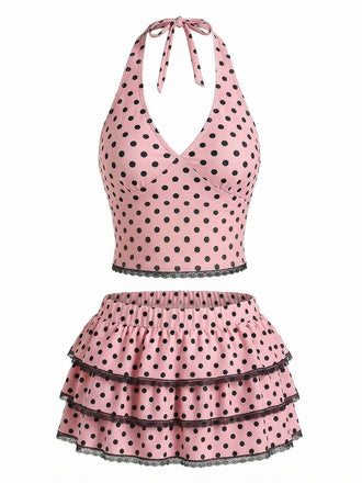 Pinkfarbenes Tankini-Top mit Polka-Dots und Rüschen-Schwimmrock im Vintage-Stil der 1950er Jahre, perfekt zum Schwimmen am Strand und für sommerliche Aktivitäten am Pool.