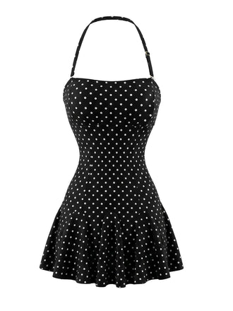 Vorderansicht eines schwarzen Badekleides im Vintage-Stil mit kleinen weißen Punkten, Neckholder und Rüschenrock.