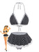 Schwarz-weiß gepunktetes Bikini-Set mit passendem Rock auf weißem Hintergrund