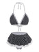 Schwarz-weiß gepunktetes Bikini-Set mit Spitzendetails auf weißem Hintergrund